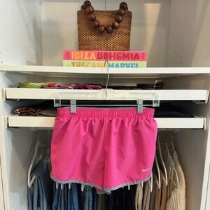 Nike dry fit running shorts size small pink with black white stripe lined